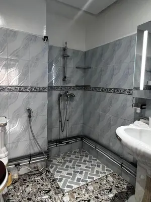 a bathroom with a shower and a sink at le spatieux in Casablanca