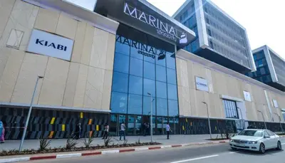 a car parked in front of a large building at le spatieux in Casablanca