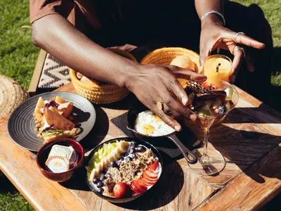 a table with plates of food and a glass of wine at ONOMO Airport Casablanca in Casablanca