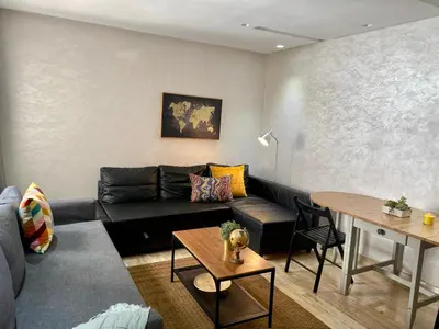 a living room with a couch and a table at Superbe appartement très bien situé WELCOME STAY in Casablanca
