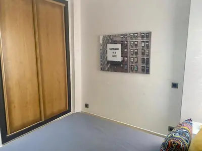 a room with a door and a picture on the wall at Superbe appartement très bien situé WELCOME STAY in Casablanca