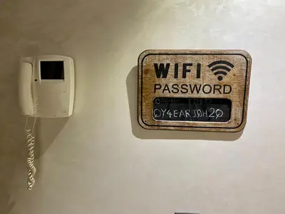 a phone on a wall with a wiiassword on it at Superbe appartement très bien situé WELCOME STAY in Casablanca