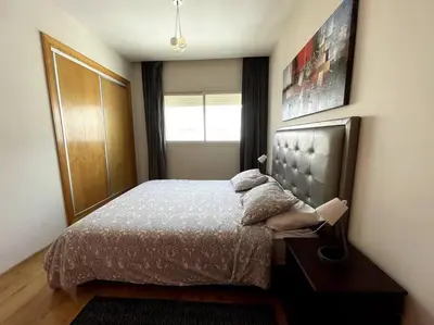a bedroom with a bed and a window at Late&Early Flight cozy Apartment in Nouaseur