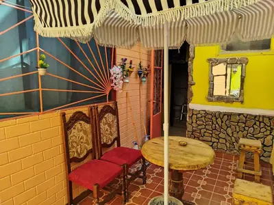a table and two chairs and a table and an umbrella at Appartement a casablanca in Casablanca