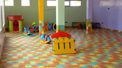 a room with a play room with toys on the floor at Dar Lazraq in Sidi Rahal