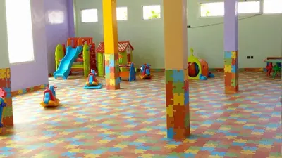 a room with a play room with a playground at Dar Lazraq in Sidi Rahal