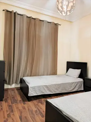 a bedroom with two beds and a window at Magnifique Villa a Savannah Beach in Sidi Rahal