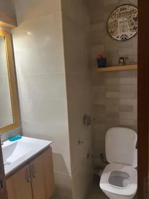 a small bathroom with a toilet and a sink at Hadil Room in Rabat