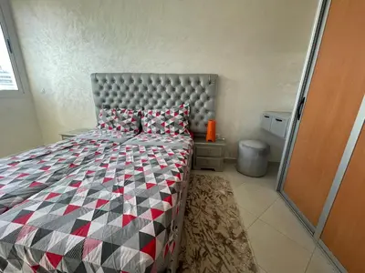 a bedroom with a large bed in a room at Melines in Casablanca