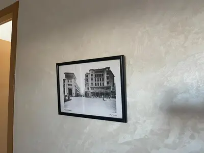 a black and white photo of a building on a wall at Melines in Casablanca