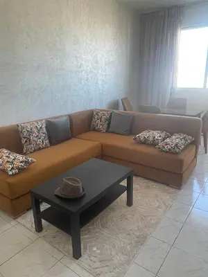 a living room with a couch and a table at Melines in Casablanca