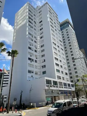 a large white building with cars parked in front of it at Melines in Casablanca