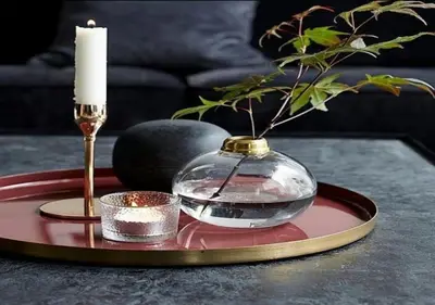 a candle and a glass bowl on a table at Charmant Appartement avec une vue imprenable in Tamaris