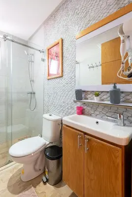 a bathroom with a toilet and a sink and a shower at Casa Lucia Family Flat Optical Fiber in Rabat