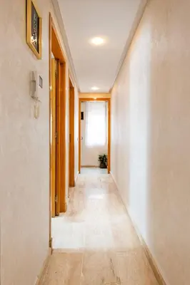 an empty hallway with a long corridor at Casa Lucia Family Flat Optical Fiber in Rabat