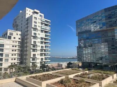 a view of two tall buildings and the ocean at Beautiful View on the sea at Casa-Marina 13 in Casablanca