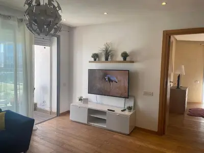 a living room with a flat screen tv on a wall at Beautiful View on the sea at Casa-Marina 13 in Casablanca