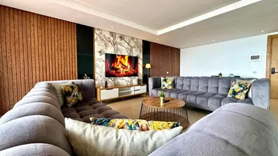 a living room with two couches and a fireplace at Marina, in a place called: Magnifique !!!!! in Casablanca