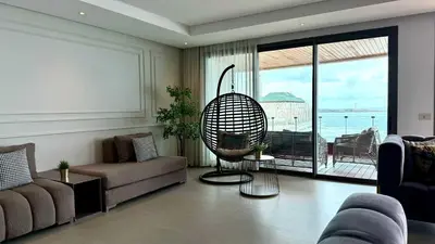 a living room with a couch and a chair at Marina, in a place called: Magnifique !!!!! in Casablanca