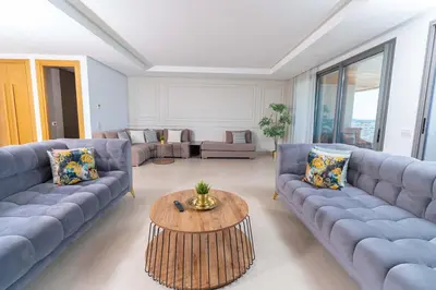 a living room with blue couches and a coffee table at Marina, in a place called: Magnifique !!!!! in Casablanca