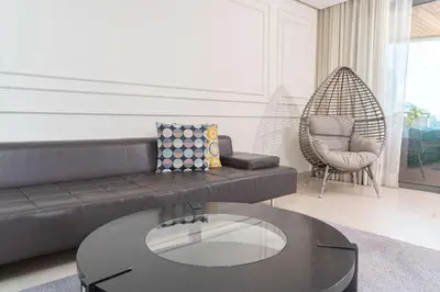 a living room with a couch and a table at KEEP CALM AND THINK OF THE SEA, MARINA!! in Casablanca