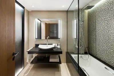 a bathroom with a sink and a shower at Radisson Blu Hotel Casablanca City Center in Casablanca