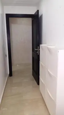 a door leading into a room with a white wall at Appartement de luxe in Casablanca