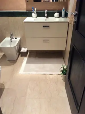 a bathroom with a sink and a toilet at Appartement de luxe in Casablanca