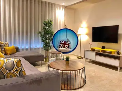 a living room with a couch and a large mirror at Luxury Top Floor, Casablanca Center... in Casablanca