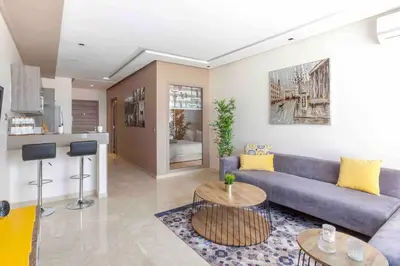 a living room with a couch and a table at Luxury Top Floor, Casablanca Center... in Casablanca