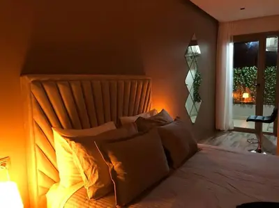 a bedroom with a bed with pillows and a window at Luxury Top Floor, Casablanca Center... in Casablanca