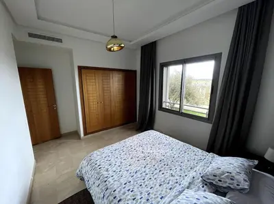 a bedroom with a bed and a window at BEST unit NEAR Casablanca AIRPORT in Casablanca
