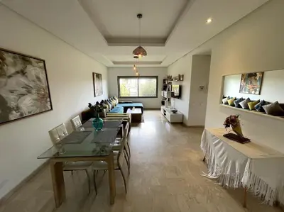 a living room with a table and a couch at BEST unit NEAR Casablanca AIRPORT in Casablanca