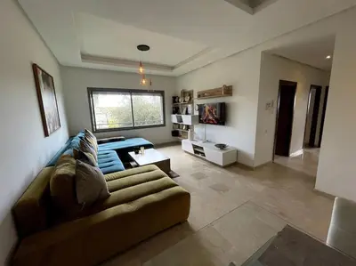 a living room with a couch and a table at BEST unit NEAR Casablanca AIRPORT in Casablanca