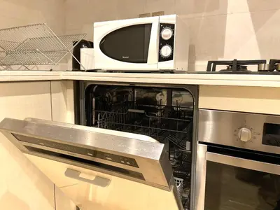 a microwave oven sitting on top of a kitchen counter at Best in Town - Central -Comfortable-in Racine in Casablanca