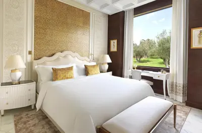 a bedroom with a large white bed and a window at The Ritz-Carlton Rabat, Dar Es Salam in Rabat