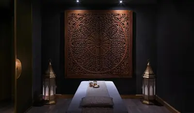 a room with a bench and a wall with a picture at The Ritz-Carlton Rabat, Dar Es Salam in Rabat