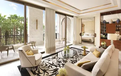 a living room with white furniture and large windows at The Ritz-Carlton Rabat, Dar Es Salam in Rabat