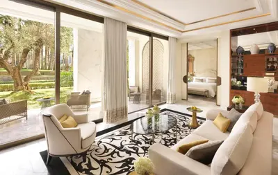 a living room with white furniture and large windows at The Ritz-Carlton Rabat, Dar Es Salam in Rabat