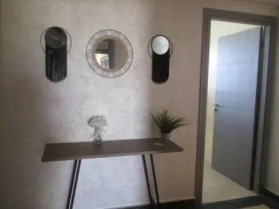 a bathroom with a table and mirrors on the wall at Mosquee & Sea View Casablanca in Casablanca