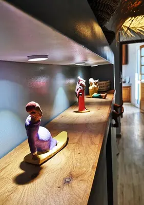 a row of toy figurines sitting on a counter at LAU 09 Studio Terrasse in Rabat