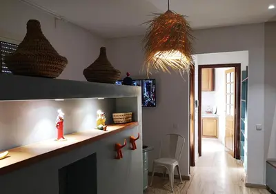 a kitchen with a counter and some baskets on the wall at LAU 09 Studio Terrasse in Rabat