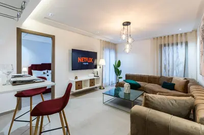 a living room with a couch and a table at Stylish & Chic Flat - Best Place - New Building in Casablanca