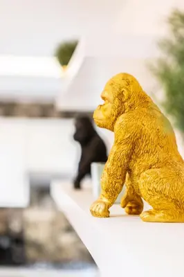 a small gold bear statue sitting on a counter at Stylish & Chic Flat - Best Place - New Building in Casablanca