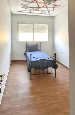a bedroom with a bed and a window at Spacious apartment in Nouaseur of 167 m² in Nouaseur