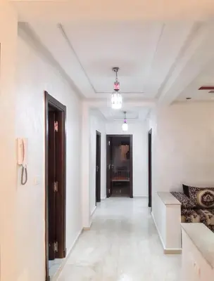 a corridor of a room with white walls and a ceiling at Spacious apartment in Nouaseur of 167 m² in Nouaseur