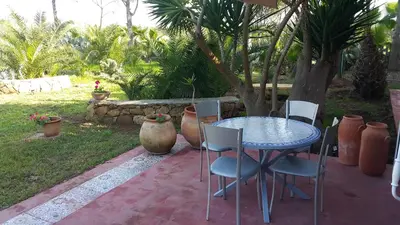 a blue table and chairs sitting on a patio at Palmeraie skhirat1 in Skhirat