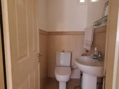 a bathroom with a white toilet and a sink at Dior D'Anfa in Casablanca