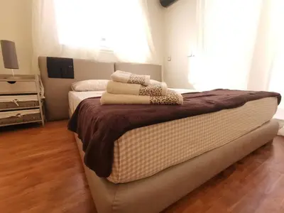 a bedroom with a bed with towels on it at Dior D'Anfa in Casablanca