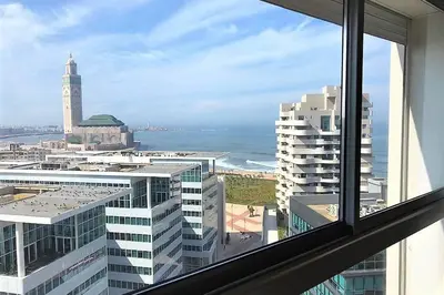 a view of the ocean from a window of a building at Very beautiful apartment with see view 5th in Casablanca